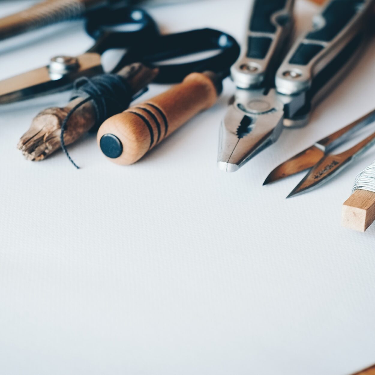 Several Handheld Tools on White Printer Paper