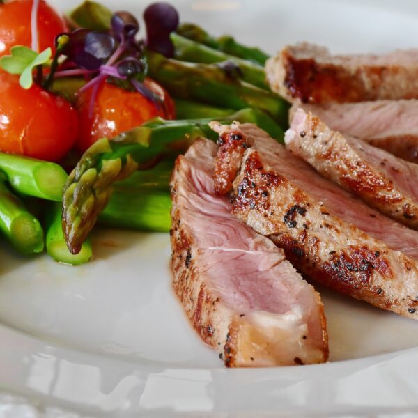 Grilled Meat Dish Served on White Plate