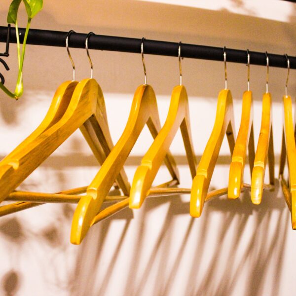 a rack of clothes hanging on a wall