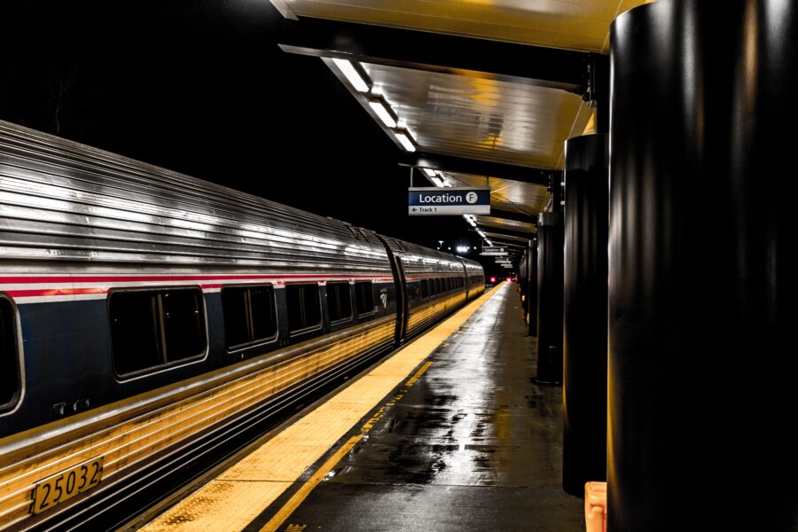 Train passing by a platform at a train station