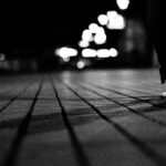 grayscale photo on person walking